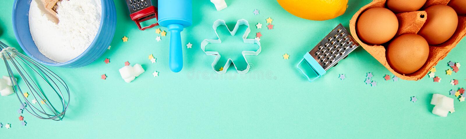 banner-baking-cooking-ingredients-bakery-frame-dessert-utensils-flour-eggs-lemon-sugar-different-tools-blue-table-169600180.jpg