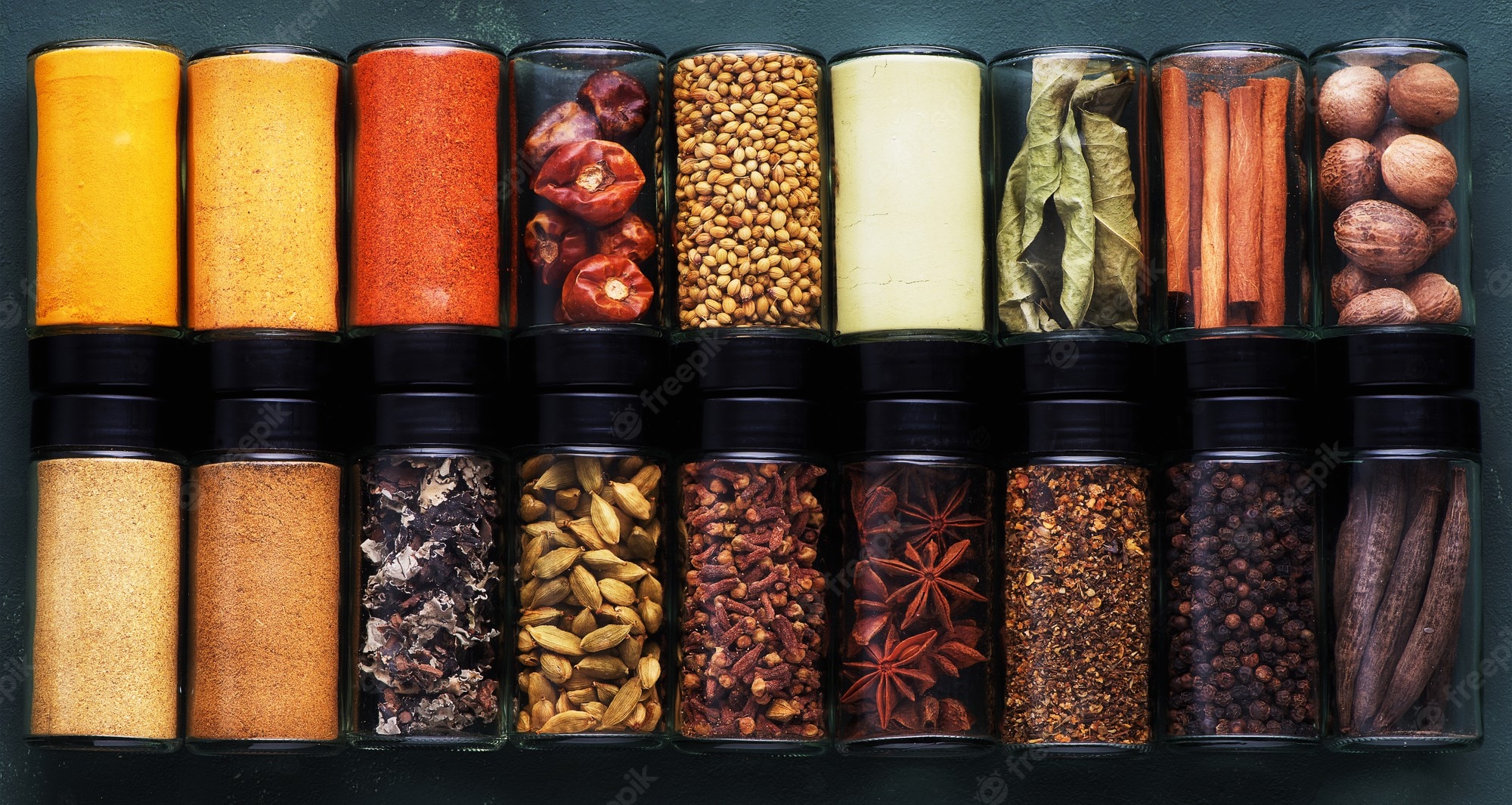 spices-spicy-banner-colorful-various-spices-seasoning-glass-jars-copy-space-top-view_440424-25.jpg